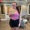 a woman posing with a gift card