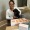a woman with a dog posing with a prize
