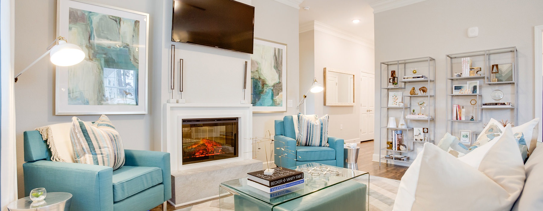 Large media room with fireplace and ample seating 