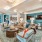 Well lit media room with ample seating 